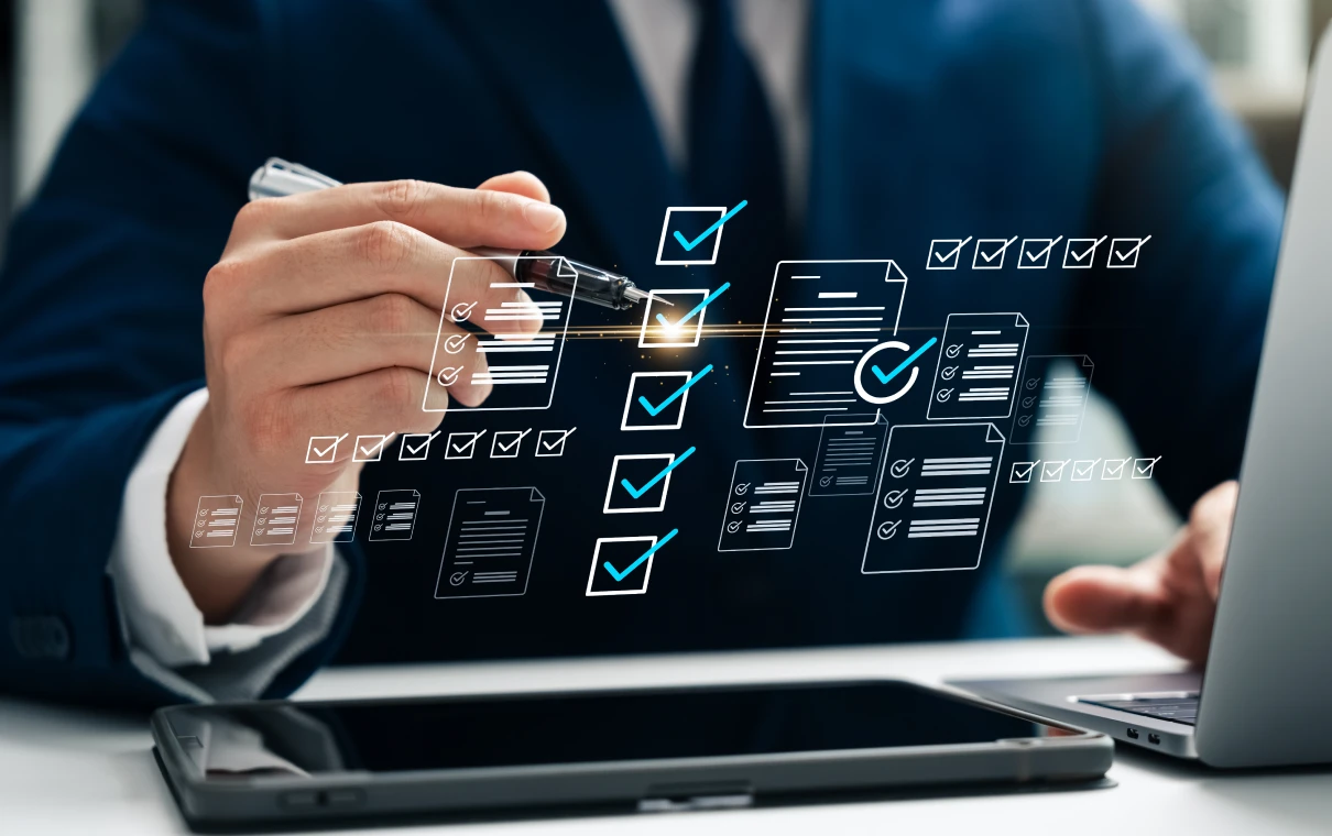Hand using pen to mark virtual checklist
