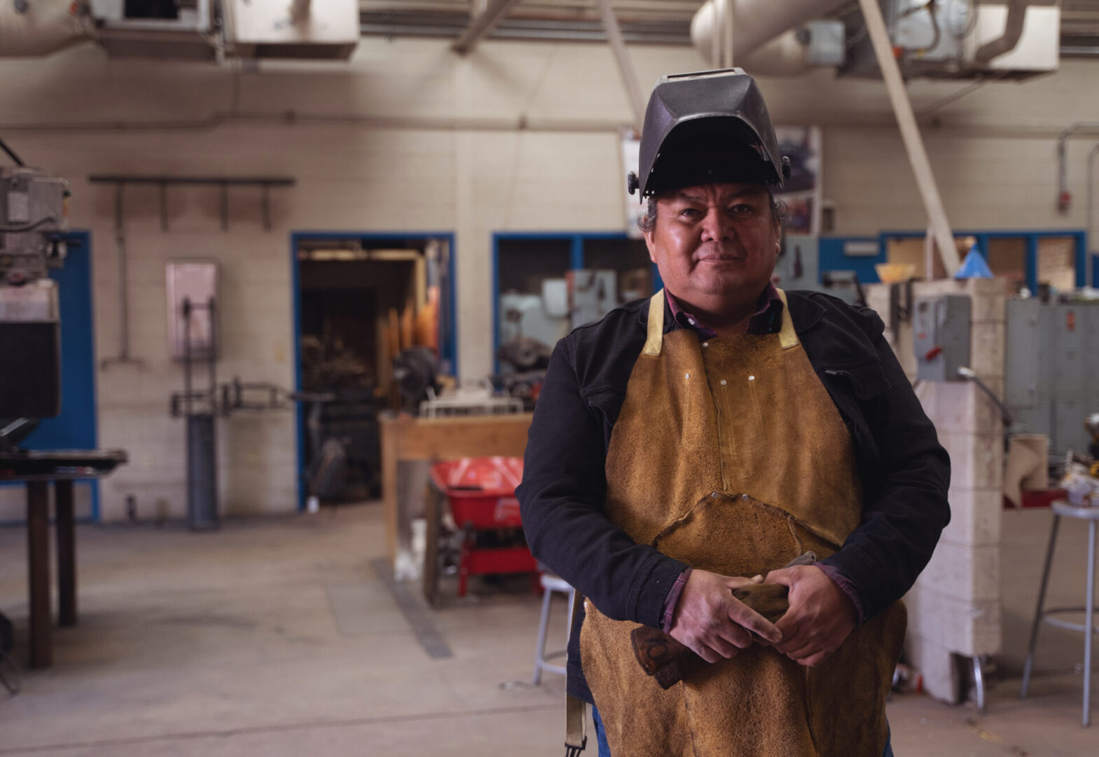 Indigenous Native American welder on his workshop in Monument Valley, Utah