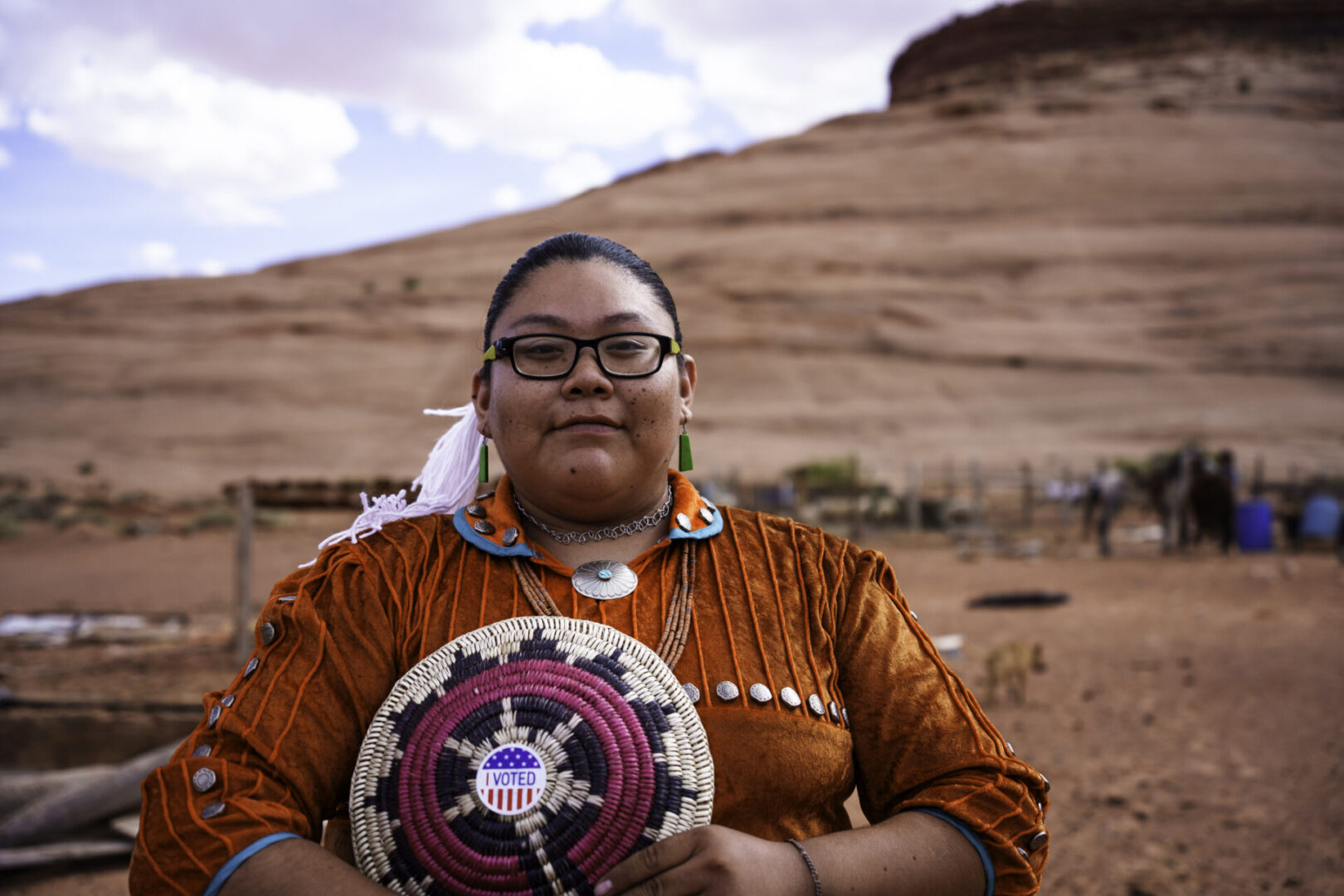 Young Navajo Woman in Monument Valley Tribal Park Arizona Holding an I Voted Sticker Doing Her Civic Duty