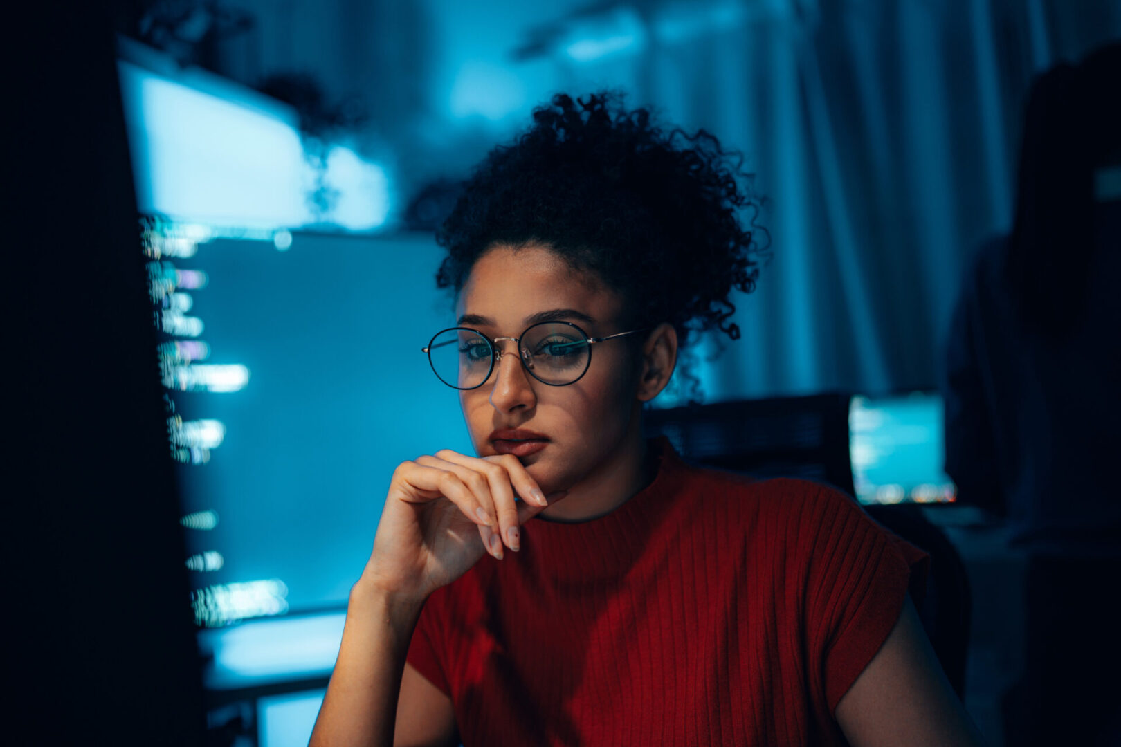 Young Hispanic woman in technology career, authentic portrait of programmer or cybersecurity professional