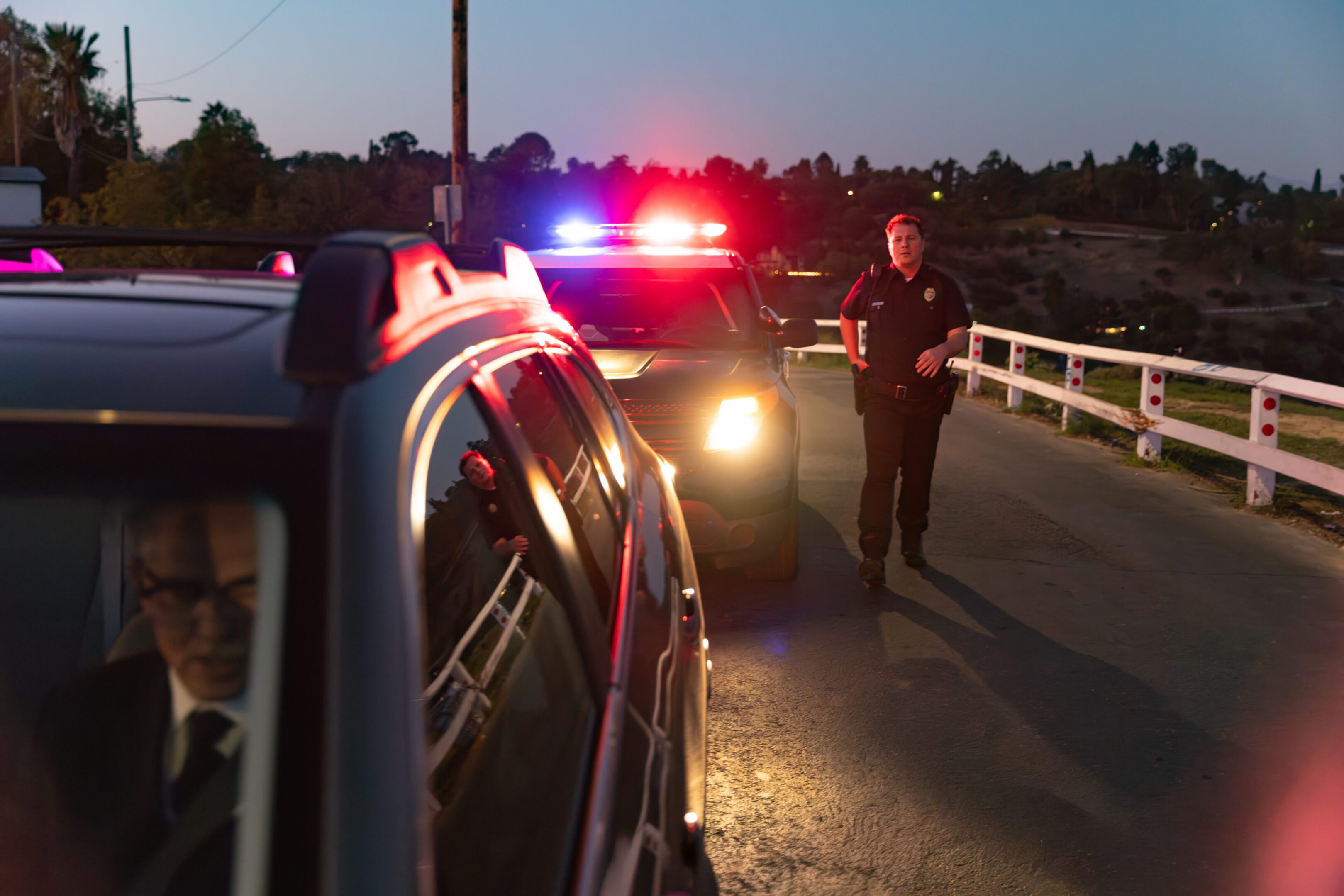 Shot of senior driver being pulled over by police.