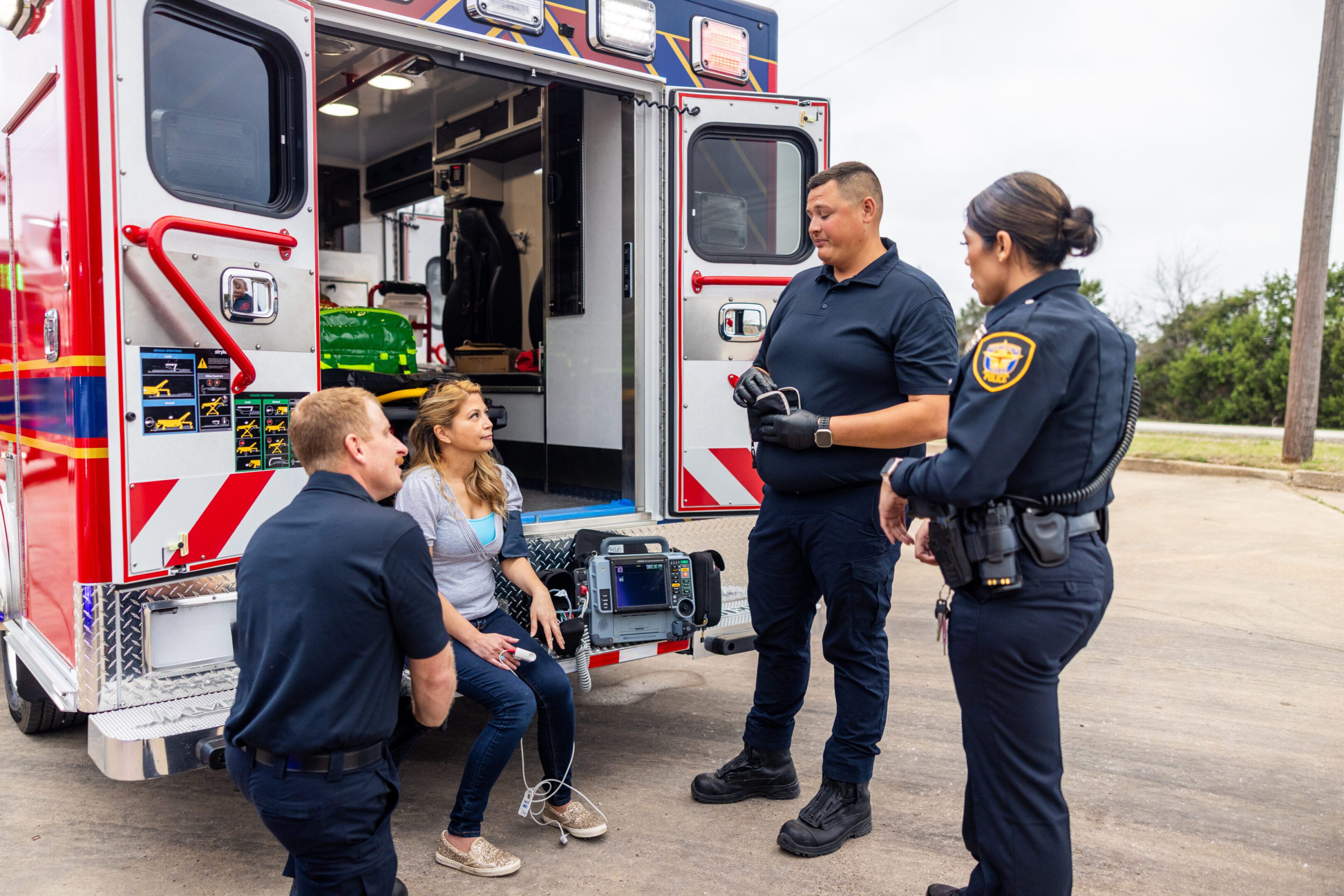 Paramedic EMT treating victim at the scene of an emergency or accident