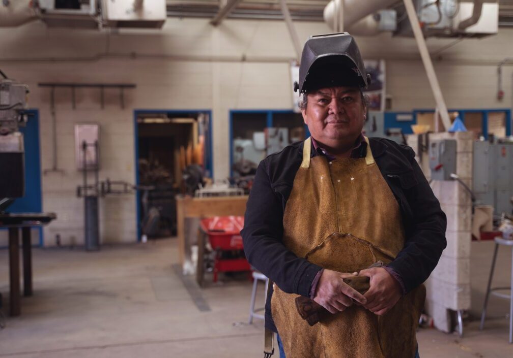 Indigenous Native American welder on his workshop in Monument Valley, Utah
