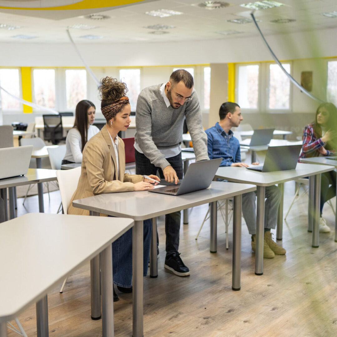 Group of people, male and female colleagues in big modern office space on business seminar.