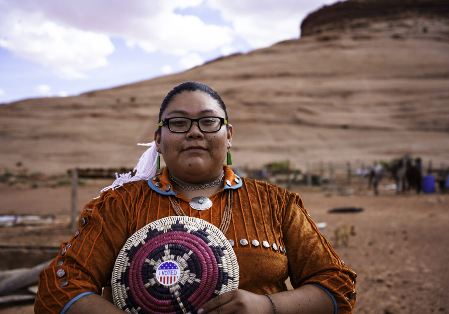Young Navajo Woman in Monument Valley Tribal Park Arizona Holding an I Voted Sticker Doing Her Civic Duty