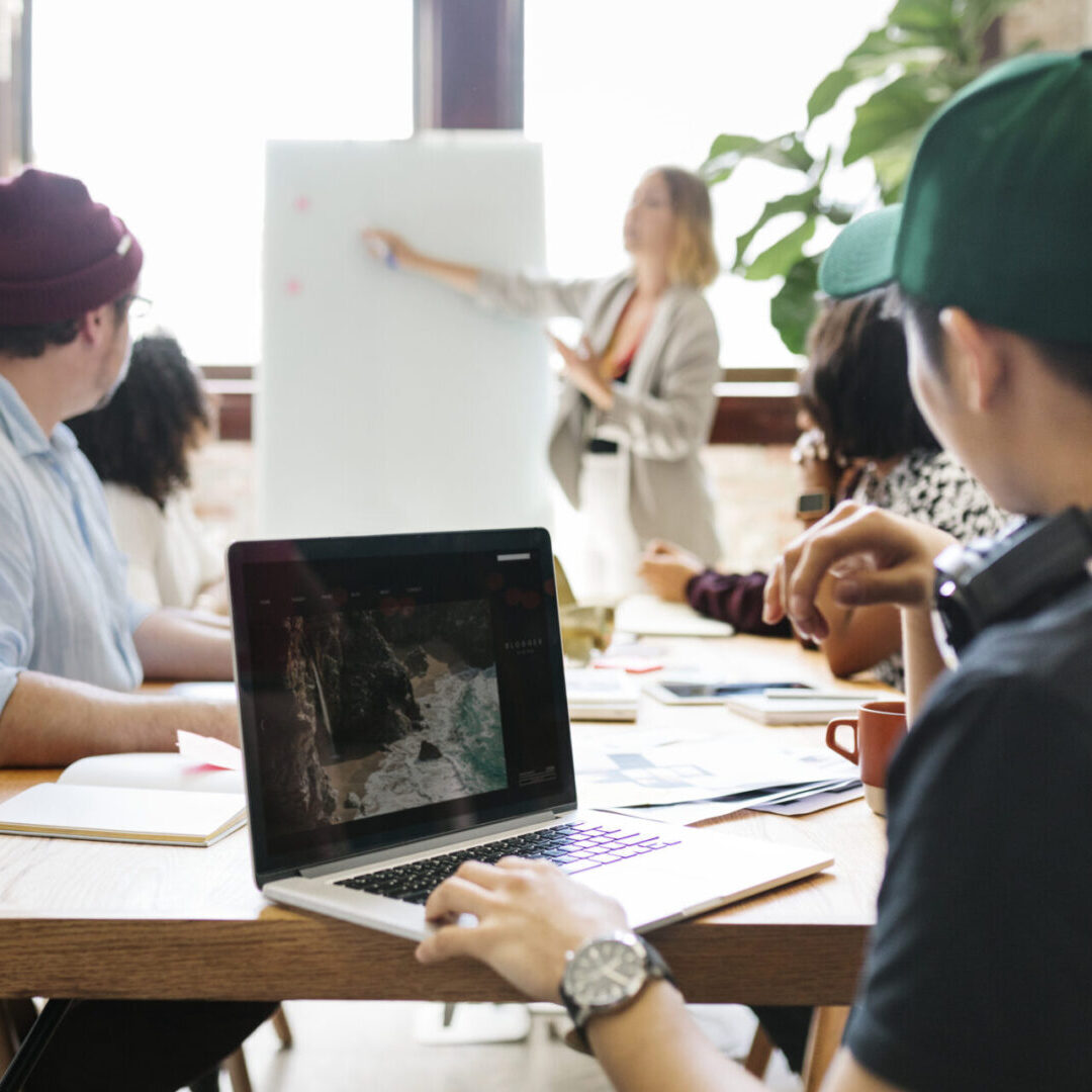 Businesswoman writing on a board in the meeting room