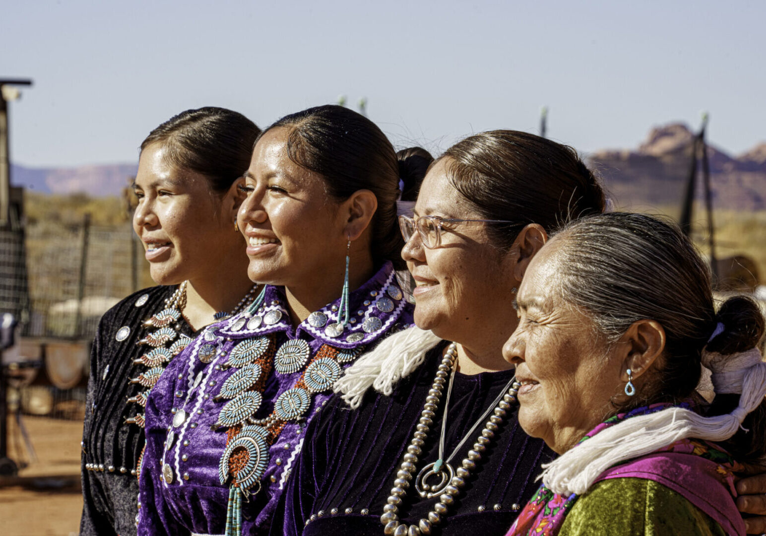 Shallow Depth of Field Portrait Four Women in Line Profile View Indigenous Navajo Family in Monument Valley Utah at the family ranch in the desert