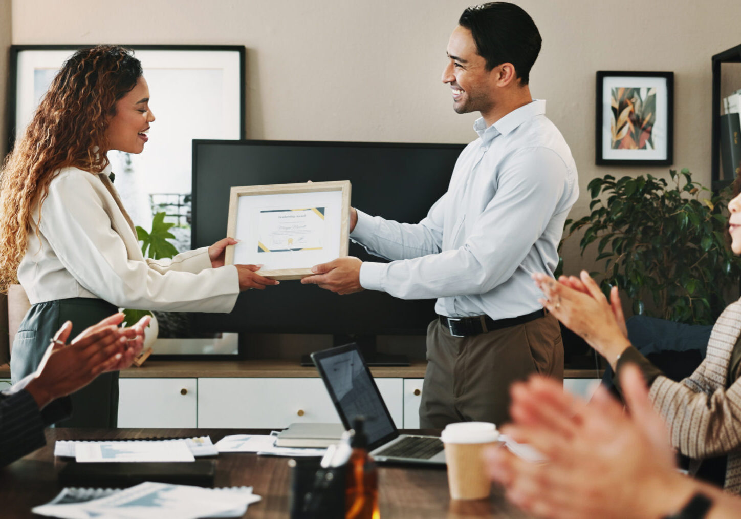 Office, woman and man with applause at award ceremony for achievement, success and well done. People, employees and happy or clapping hands at boardroom with certificate for celebration or completion