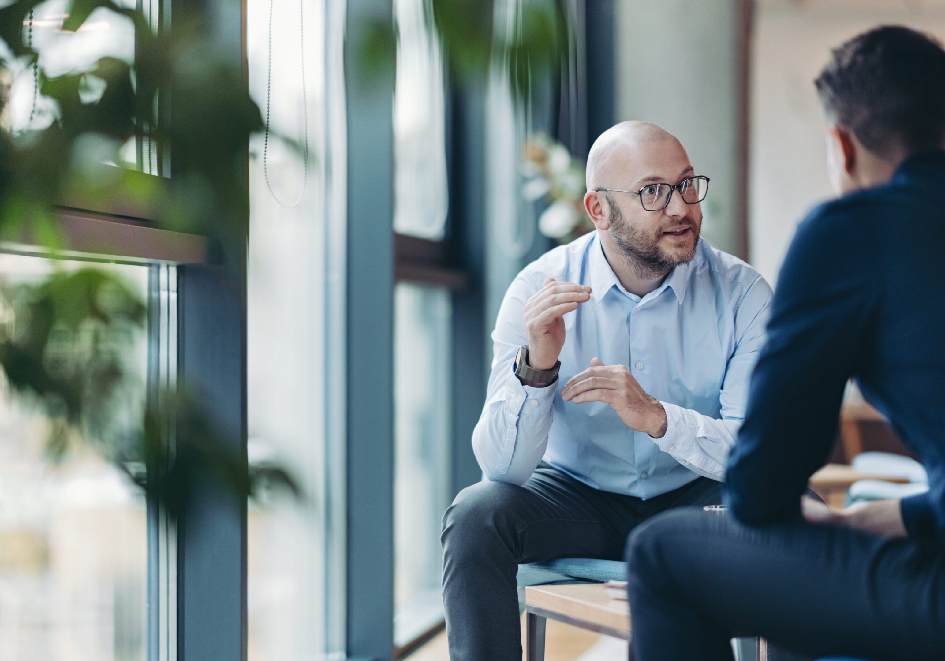Two businessmen talking in the office